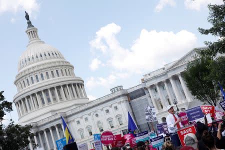 Sen. Ron Wyden (D-OR) speaks during a demonstration against the Republican repeal of the Affordable Care Act, outside the U.S. Capitol in Washington, U.S., June 21, 2017. REUTERS/Aaron P. Bernstein