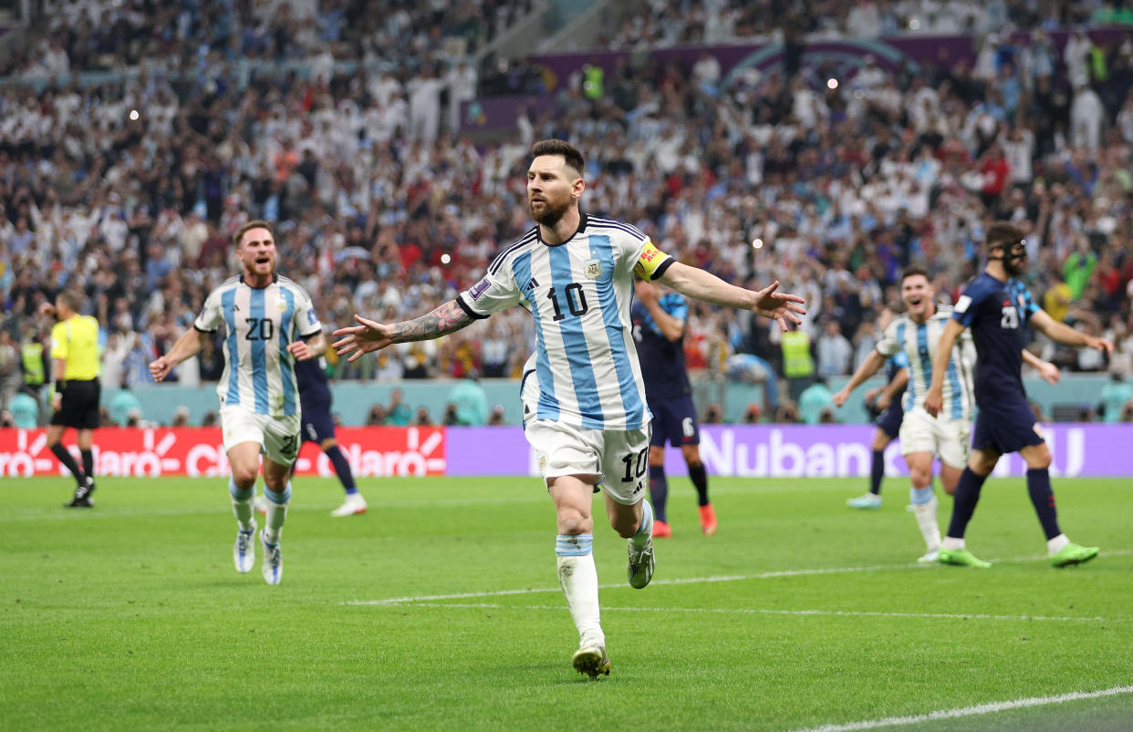 LUSAIL CITY, QATAR - DECEMBER 13: Lionel Messi of Argentina celebrates after scoring the team's first goal during the FIFA World Cup Qatar 2022 semi final match between Argentina and Croatia at Lusail Stadium on December 13, 2022 in Lusail City, Qatar. (Photo by Richard Heathcote/Getty Images)