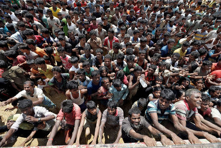 Rohingya refugees react as aid is distributed in Cox's Bazar, Bangladesh, September 21, 2017. REUTERS/Cathal McNaughton TPX IMAGES OF THE DAY