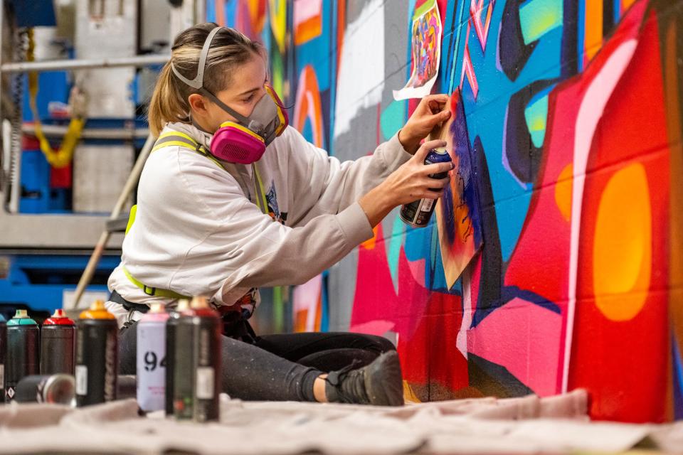 Koda Witsken is a much-in-demand muralist with clients across Central Indiana and the country. On Monday, Feb. 6, 2023, she was working on the last phase of a project at a Target Distribution Center in Indianapolis.