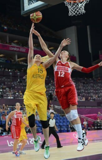 Russian centre Irina Osipova (R) jumps for the ball with Australian centre Lauren Jackson during the London 2012 Olympic Games women's bronze medal basketball game at the North Greenwich Arena in London. Australia won 83-74