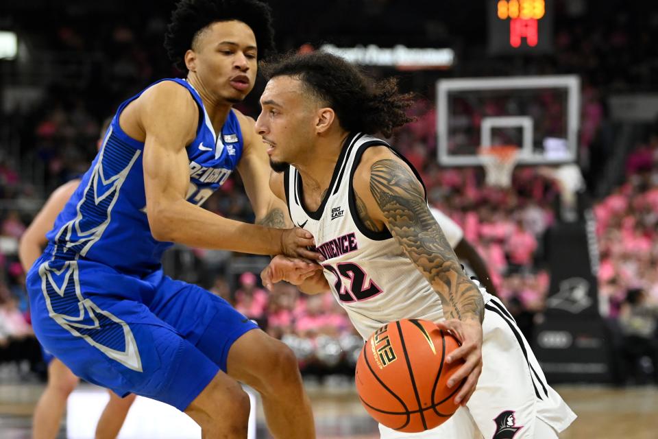 Providence guard Devin Carter drives to the basket against Creighton guard Trey Alexander during their game on Feb. 7 in Providence.