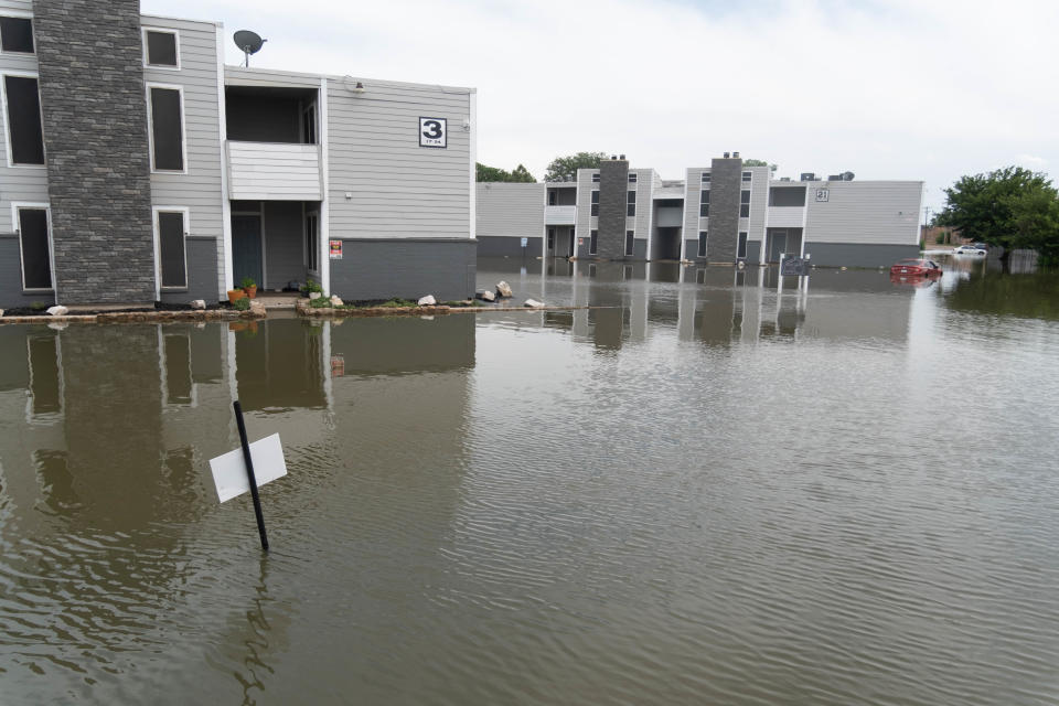 Apartments near Lawrence Lake surrounded by flood waters from Lawrence Lake in Amarillo.