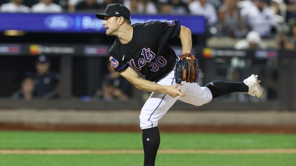 Jun 13, 2023; New York City, New York, USA; New York Mets relief pitcher David Robertson (30) delivers a pitch during the ninth inning against the New York Yankees at Citi Field.