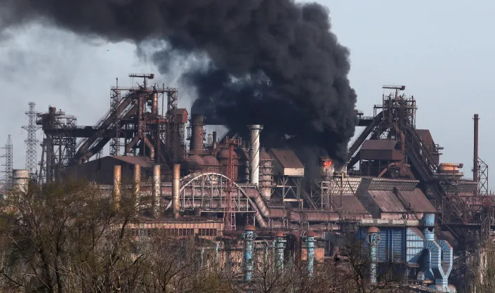 Smoke rises above the Azovstal Iron and Steel Works plant.