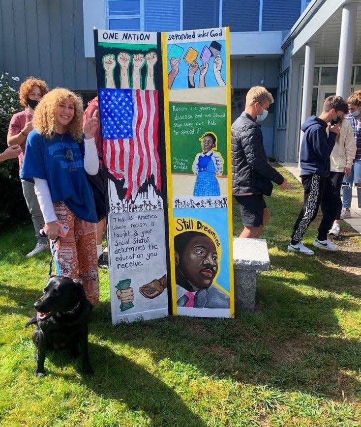 Claudia Corcoran stages a walkout Wednesday, Sept. 29, 2021, at York High School to protest the removal of her artwork from the YHS library. Corcoran is a senior.