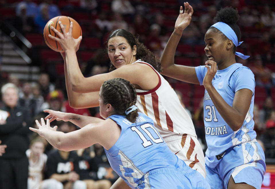 Iowa State center Stephanie Soares looks to pass away from North Carolina forward Anya Poole, right, and guard Eva Hodgson during the first half of an NCAA college basketball game in the Phil Knight Invitational in Portland, Ore., Sunday, Nov. 27, 2022. (AP Photo/Craig Mitchelldyer)