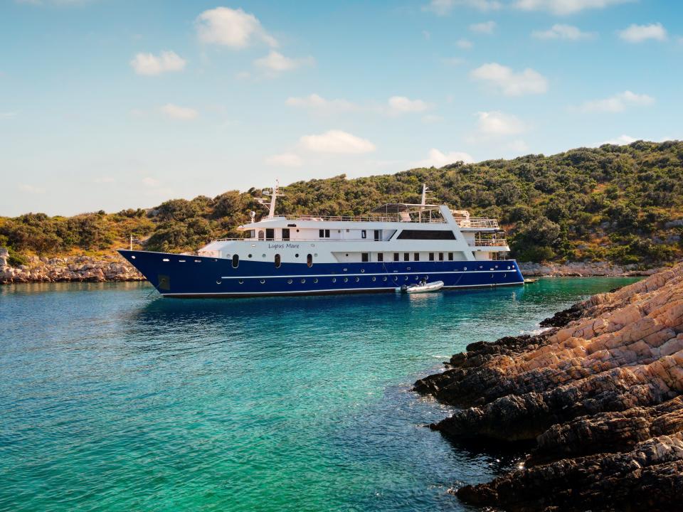 lupus mare yacht on water by land