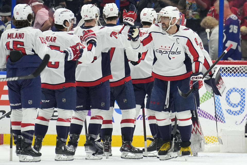 Washington Capitals left wing Alex Ovechkin (8) celebrates with teammates after the Capitals defeated the Tampa Bay Lightning during an NHL hockey game Thursday, Feb. 22, 2024, in Tampa, Fla. (AP Photo/Chris O'Meara)