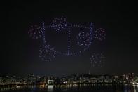 Drones fly over the Han river showing messages to support the country as measures to avoid the spread of the coronavirus disease (COVID-19) continue in Seoul