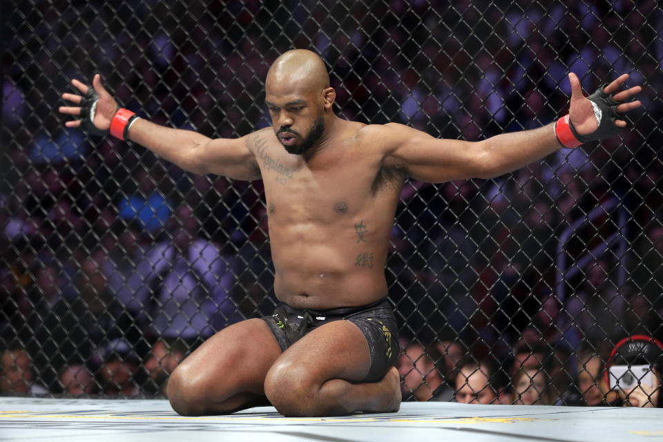 Jon Jones goes through his pre-fight routine in the ring before a light heavyweight mixed martial arts bout against Dominick Reyes at UFC 247 Saturday, Feb. 8, 2020, in Houston. (AP Photo/Michael Wyke)