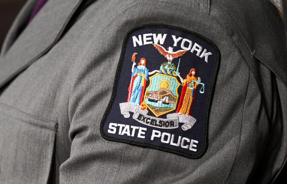 The New York State Police logo is seen during a graduation ceremony at the Empire State Plaza Convention Center on Wednesday, Oct. 19, 2022, in Albany, N.Y. The 211th basic school session graduated 218 new troopers. (AP Photo/Hans Pennink)
