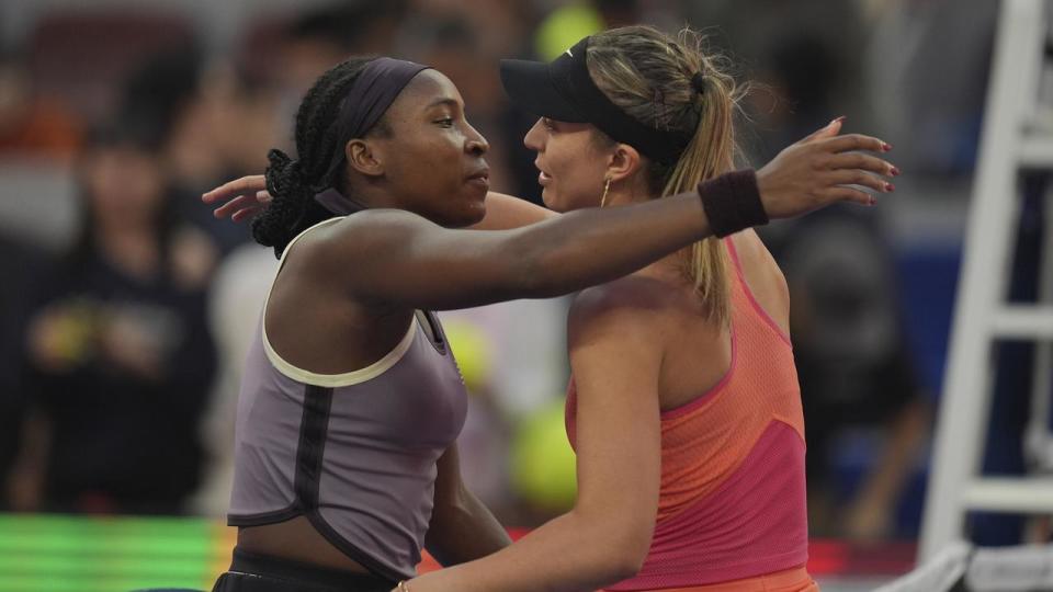 Coco Gauff and Paula Badosa embrace.