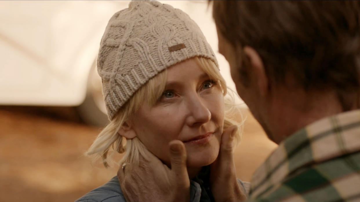  Anne Heche stands with a content look, while Thomas Jane holds her face in his hands in The Vanished. 