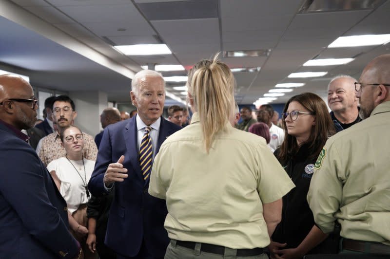 President Joe Biden meets with FEMA employees at their headquarters in Washington, D.C., on Thursday. Photo by Yuri Gripas/UPI