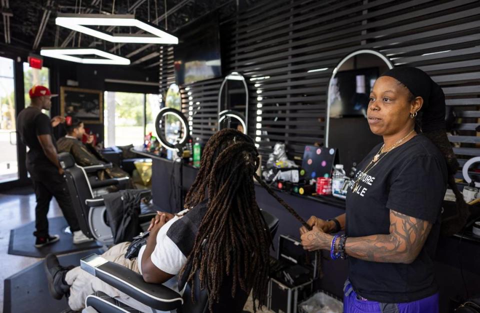 Hairstylist and mayoral candidate for Pompano Beach Debresia LeSane, far right, styles Carolyn Hickson’s hair at Checkmate Barbershop in the Sistrunk neighborhood on Tuesday, July 2, 2024, in Fort Lauderdale, Florida.