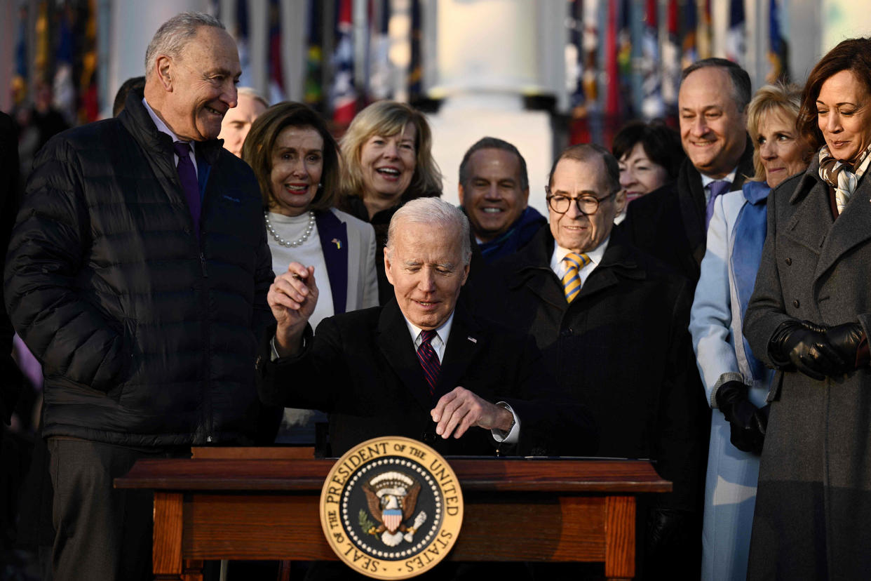 President Joe Biden signs the Respect for Marriage Act on the South Law of the White House in on Dec. 13, 2022. (Brendan Smialowski / AFP - Getty Images)