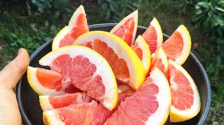 Flame grapefruit wedges on plate