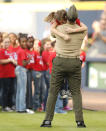 <p>U.S. Army staff sergeant Clayton Walker surprises his daughter Cassidy, after an 11 month assignment overseas on the field after Cassidy sang the national anthem before the game between the Atlanta Braves and the Philadelphia Phillies at Turner Field on May 11, 2016 in Atlanta, Georgia. (Photo by Mike Zarrilli/Getty Images) </p>