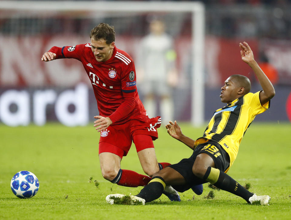 Bayern midfielder Leon Goretzka, left, and AEK's Alef fight for the ball during the Champions League group E soccer match between FC Bayern Munich and AEK Athen in Munich, Germany, Wednesday, Nov. 7, 2018. (AP Photo/Matthias Schrader)