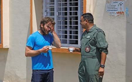 British Climber and expedition’s deputy leader, Mark Thomas reacts as he talks to an Indian Air Force pilot in Pithoragarh