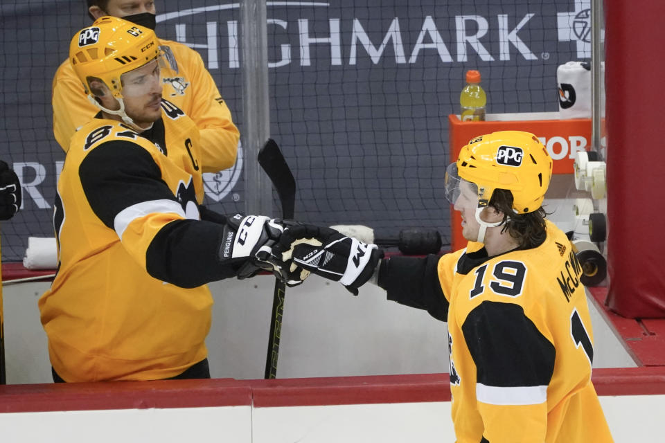 Pittsburgh Penguins' Jared McCann (19) is greeted by Sidney Crosby (87) after scoring against the Philadelphia Flyers during the first period of an NHL hockey game Thursday, March 4, 2021, in Pittsburgh. (AP Photo/Keith Srakocic)