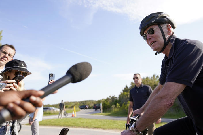 President Joe Biden speaks to members of the media as he goes on a bike ride in Gordons Pond State Park in Rehoboth Beach, Del., Sunday, May 14, 2023. (AP Photo/Carolyn Kaster)