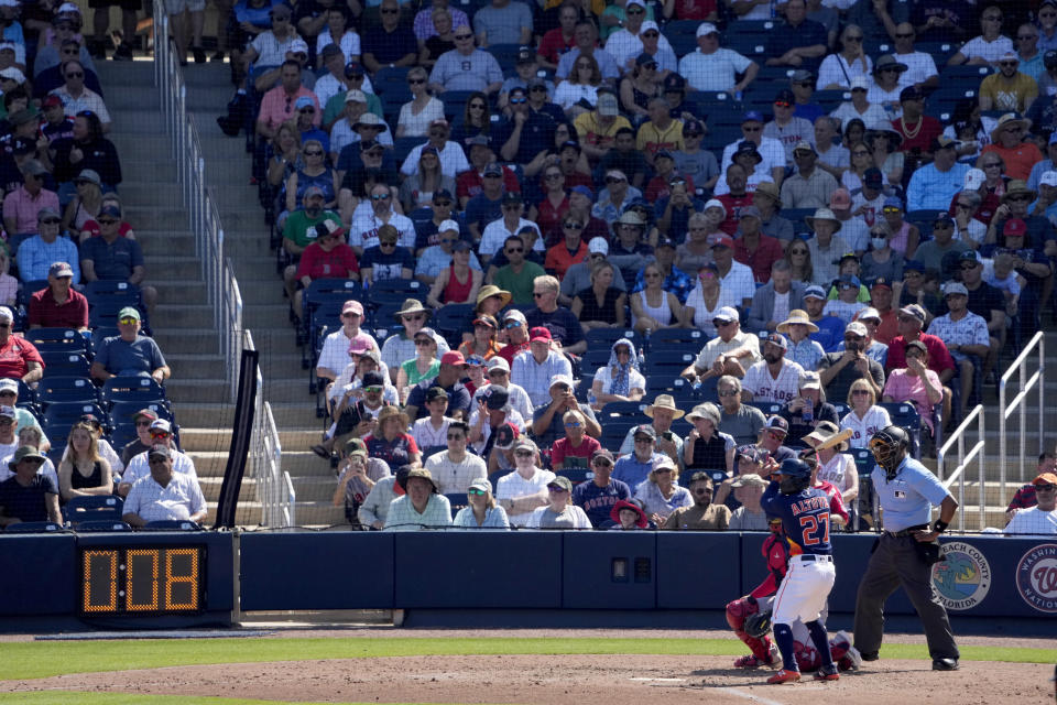 Houston Astros' Jose Altuve (27) bats as the pitch clock ticks down during the fifth inning of a spring training baseball game against the Boston Red Sox Wednesday, March 1, 2023, in West Palm Beach, Fla. (AP Photo/Jeff Roberson)