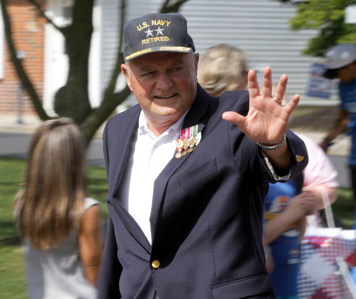 Retired Navy Admiral and Toms River Mayor Mo Hill waves along Washington Street during the town's Memorial Day Parade Monday, May 29, 2023. The parade and ceremony outside Town Hall honors America's war dead and is organized by American Legion Post 129 in the town.