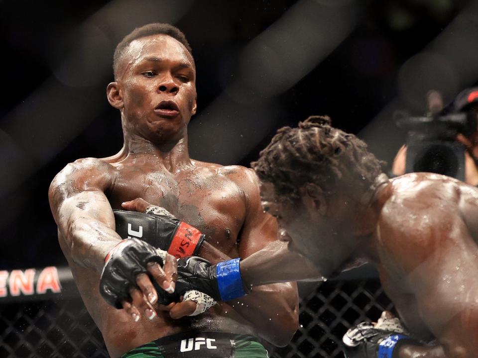 Israel Adesanya (left) outpointed Jared Cannonnier comfortably to remain middleweight champion (Getty Images)