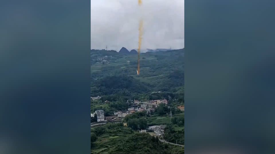 A screenshot taken from a video shows alleged debris from a Chinese rocket falling on the village of Xianqiao, Guizhou province, China, after a launch.  - Kuaishou