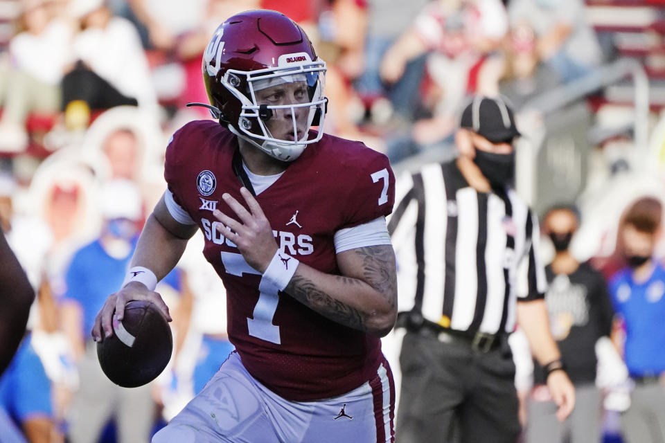 Oklahoma quarterback Spencer Rattler (7) carries for a touchdown in the first half of an NCAA college football game against Kansas in Norman, Okla., Saturday, Nov. 7, 2020. (AP Photo/Sue Ogrocki)