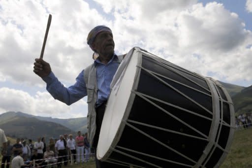 A musician performs with his traditional drum during the Circumcision Festival in the village of Lubinje, on border between Kosovo and Macedonia. Every five years the people of the village organise a three-day Sunet (circumcision) Festival, where this year 90 boys, aged from 10 months to 5 years, were circumcised