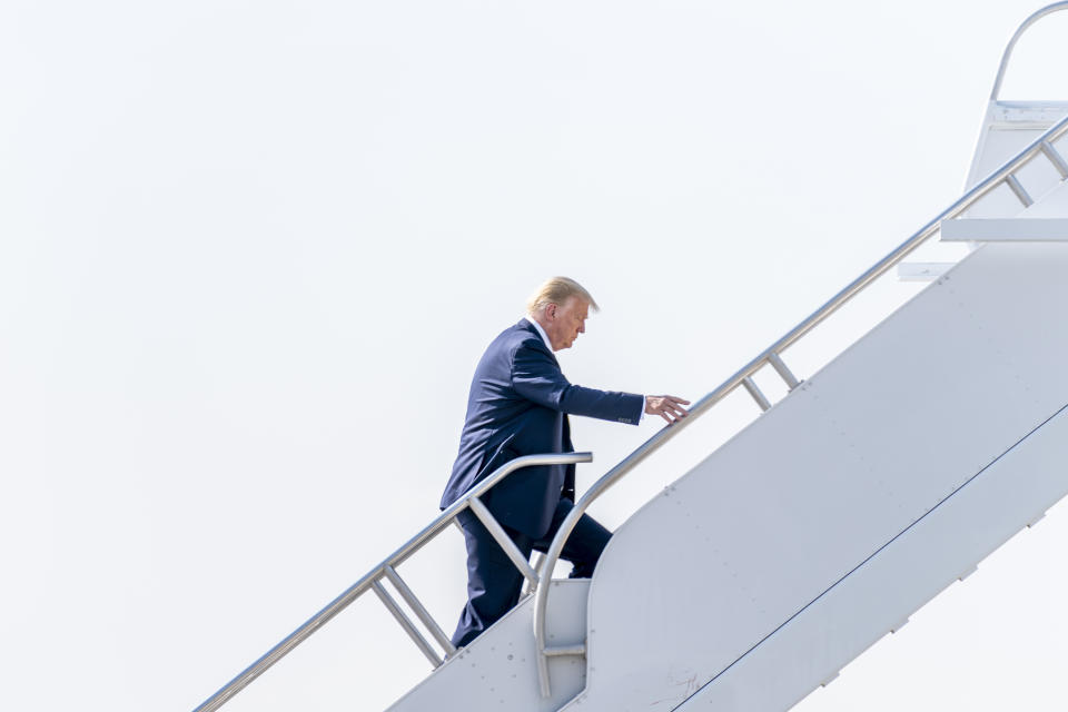 President Donald Trump boards Air Force One at McCarran International Airport in Las Vegas, Monday, Sept. 14, 2020, to travel to Sacramento McClellan Airport, in McClellan Park, Calif., for a briefing on wildfires. (AP Photo/Andrew Harnik)