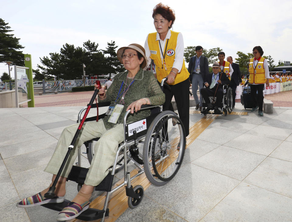 South Koreans leave for North Korea to take part in family reunions with their North Korean family members at the customs, immigration and quarantine (CIQ) office, in Goseong, South Korea, Monday, Aug. 20, 2018. About 200 South Koreans and their family members prepared to cross into North Korea on Monday for heart-wrenching meetings with relatives most haven't seen since they were separated by the turmoil of the Korean War. (Korea Pool/Yonhap via AP)