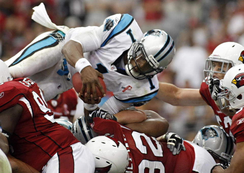 Cam Newton's rookie debut against Arizona in 2011 set NFL records. (Photo AP/Ralph Freso)