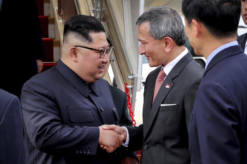 <p>North Korean leader Kim Jong Un, left, is greeted by Singapore Minister for Foreign Affairs Dr. Vivian Balakrishnan at the Changi International Airport, Sunday, June 10, 2018, in Singapore, ahead of a summit with President Donald Trump. (Photo: Ministry of Communications and Information Singapore via AP) </p>