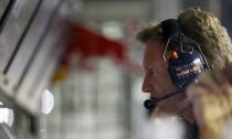 Red Bull Formula One team principal Christian Horner looks at a screen on the pit wall during the qualifying session of the Singapore Formula One Grand Prix September 21, 2013. REUTERS/Pablo Sanchez (SINGAPORE - Tags: SPORT MOTORSPORT F1)