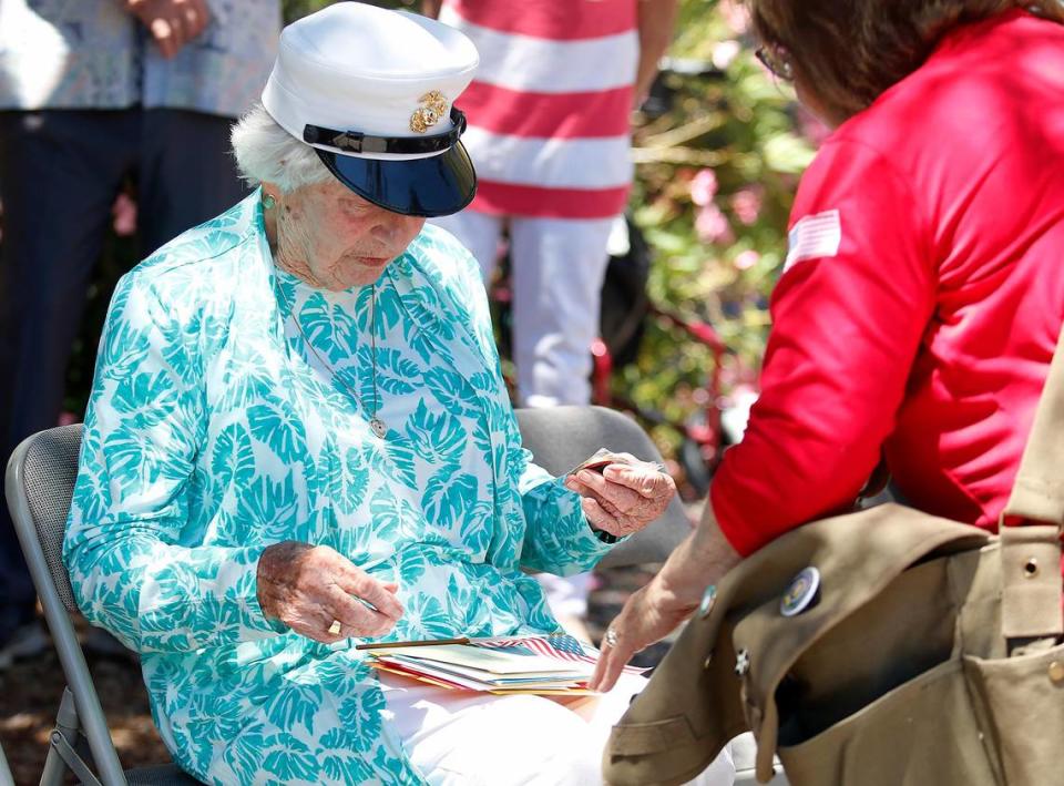 U.S. Marine Corps veteran Sgt. Elizabeth Ross looks at letters during a July 2, 2022, birthday celebration hosted by Welcome Home Military Heroes at her daughter’s San Luis Obispo home. Ross turns 100 on July 5.