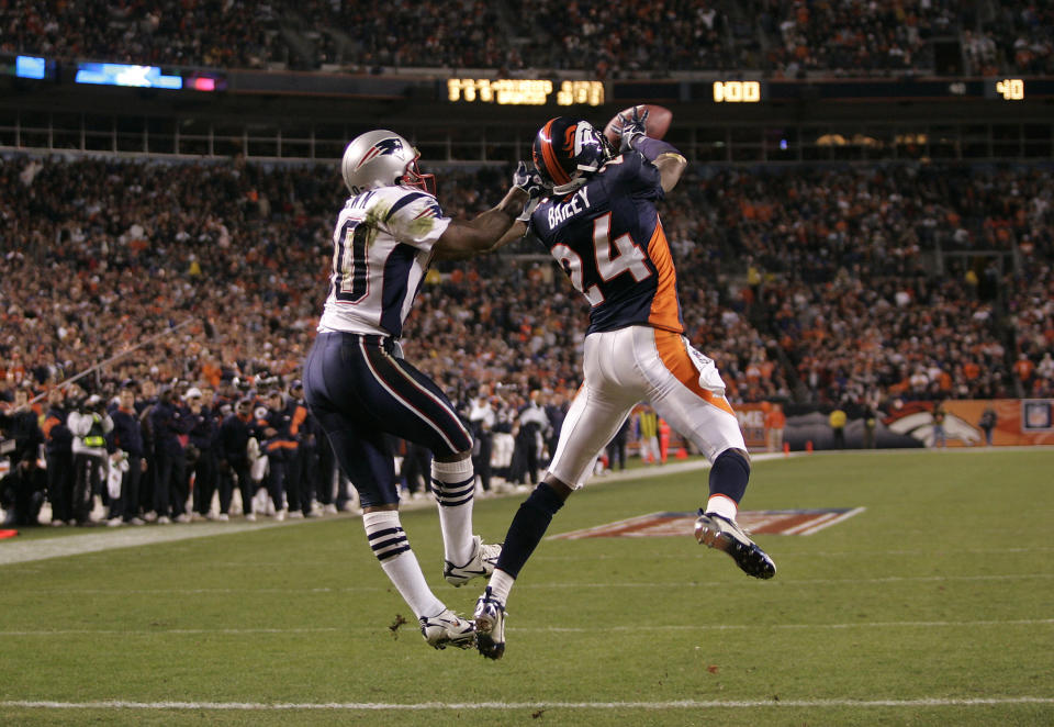 Cornerback Champ Bailey intercepts a Tom Brady pass in the end zone during a divisional round playoff game at the end of the 2005 season. (Getty Images)