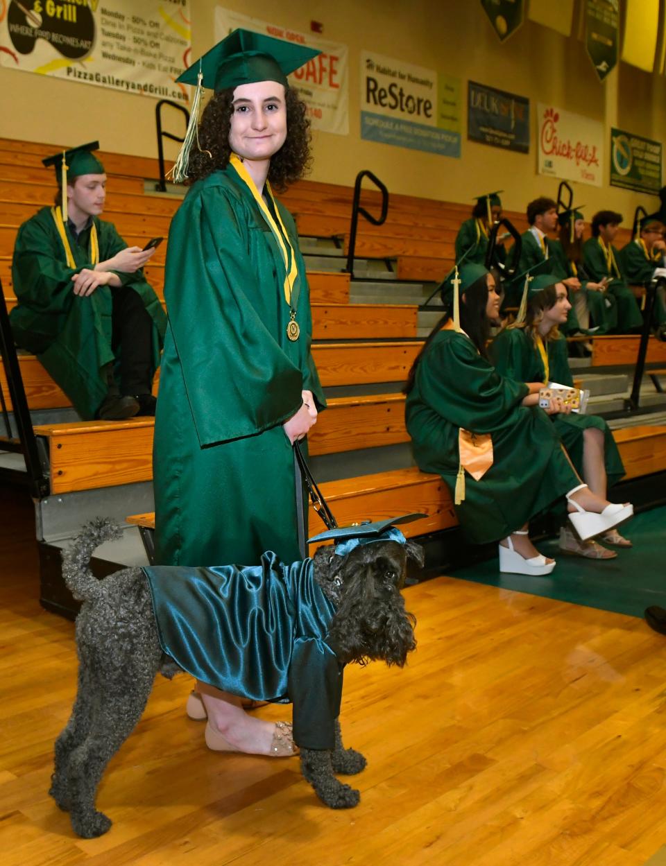 Viera High School senior Jax Russack-Cradeur, 18, graduated with her service dog Pint, a 5-year-old Kerry Blue Terrier. Jax has postural orthostatic tachycardia syndrome, also known as POTS. Pint is the first service dog to graduate from Viera High.