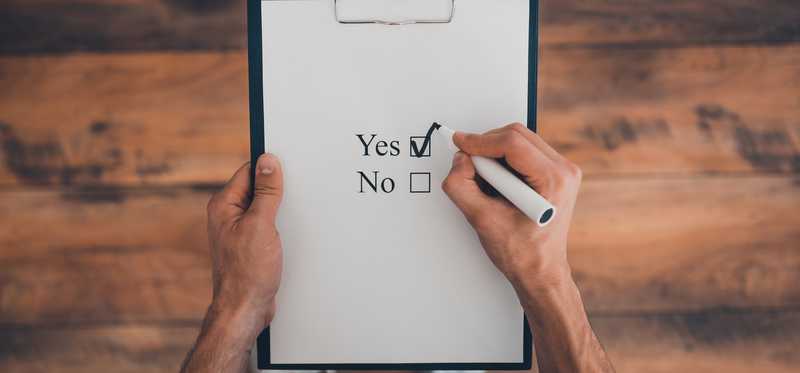 A piece of paper with yes and no check boxes and the yes box is checked