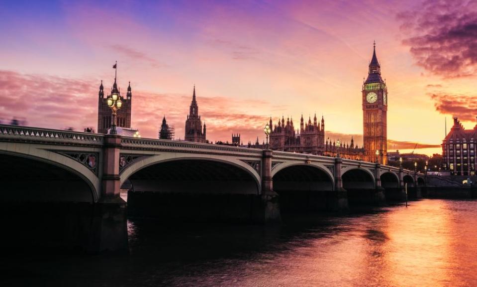 Dramatic sunset over famous Big Ben clock tower in London.