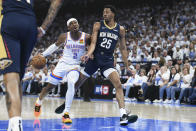 Oklahoma City Thunder guard Shai Gilgeous-Alexander (2) drives past New Orleans Pelicans guard Trey Murphy III (25) in the first half of Game 1 of an NBA basketball first-round playoff series, Sunday, April 21, 2024, in Oklahoma City. (AP Photo/Kyle Phillips)