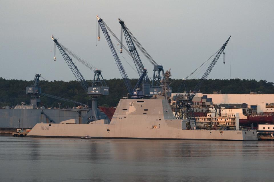 The USS Lyndon B. Johnson is docked at Bath Iron Works on the Kennebec River, Friday, Aug. 27, 2021, in Bath, Maine. The stealth destroyer is the last of three Zumwalt-class ships built by BIW. (AP Photo/Robert F. Bukaty)