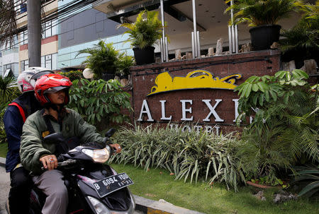 A motorist drives past the Alexis Hotel in Jakarta, Indonesia, October 19, 2017. Picture taken October 19, 2017. REUTERS/Beawiharta