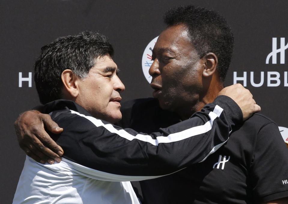 Diego Maradona and Pele pose after a football match organised at the Jardin du Palais Royal in Paris on June 9, 2016, on the eve of the Euro 2016 European football championship. (AFP via Getty Images)