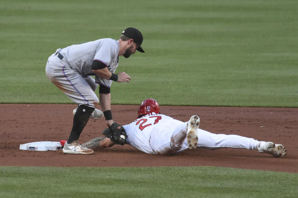 Miami Marlins second baseman Jon Berti tags out St. Louis Cardinals' Tyler O'Neill on a steal attempt during the second inning of a baseball game Tuesday, June 15, 2021, in St. Louis. (AP Photo/Joe Puetz)