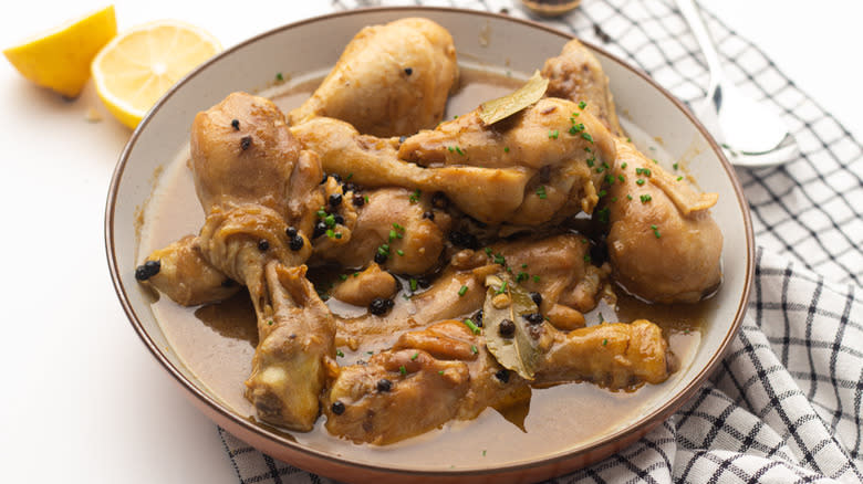 chicken legs in brownish sauce