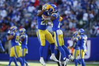 Los Angeles Rams' Taylor Rapp, right, celebrates his interception with Terrell Burgess during the second half of an NFL football game against the New York Giants, Sunday, Oct. 17, 2021, in East Rutherford, N.J. (AP Photo/John Munson)